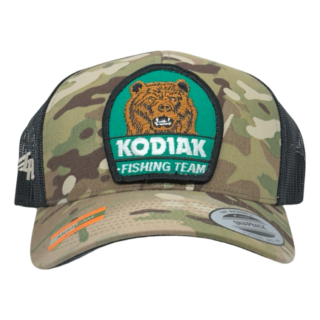 Vintage Kodiak Fishing Team Patch sewn onto New Yupoong 6606 Multicam Original Camo Black