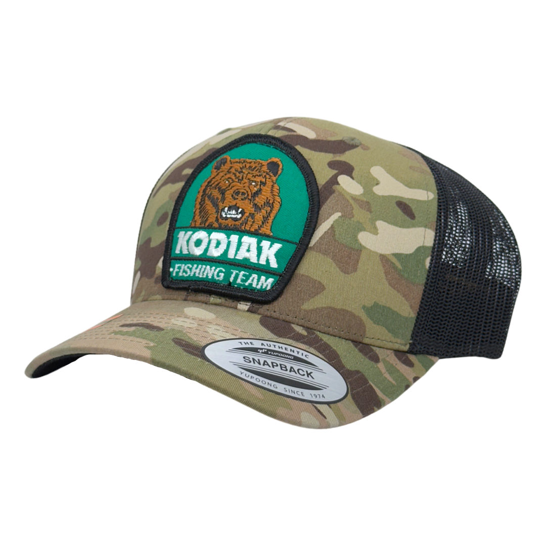 Vintage Kodiak Fishing Team Patch sewn onto New Yupoong 6606 Multicam Original Camo Black