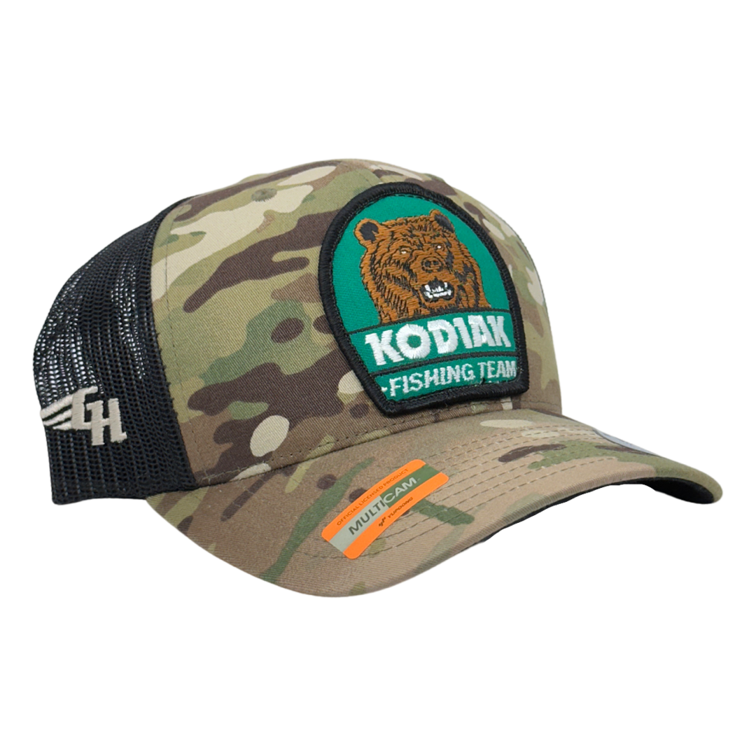 Vintage Kodiak Fishing Team Patch sewn onto New Yupoong 6606 Multicam Original Camo Black