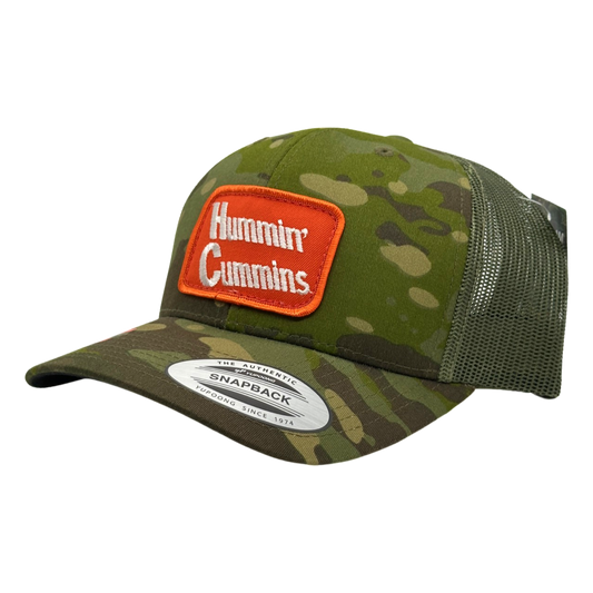 Vintage Hummin’ Cummins Patch sewn onto New Yupoong 6606 Multicam Tropic Green Camo